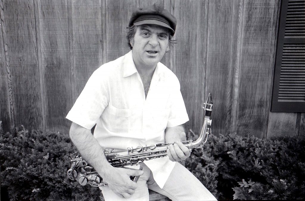 Black and white photo of Joe Romano with sax